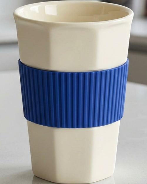 Kpbxg Six-Facet Ceramic Water Cup with Silicone Grip Sleeve 14 oz Ivory Cobalt - Lifestyle view